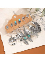 Bohemian turquoise earrings set by Huitich featuring silver leaf, tree, and tribal designs