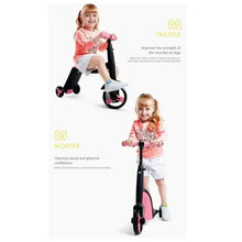Kids tricycle scooter with black frame and pink wheels in full standing setup