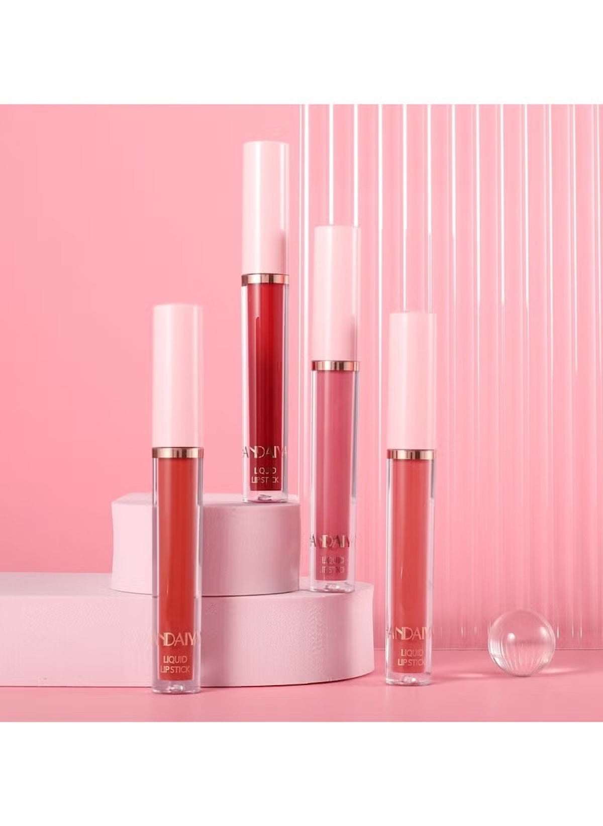 Huitich 6 piece matte lip kit with four shades of matte lip glosses displayed on pink background