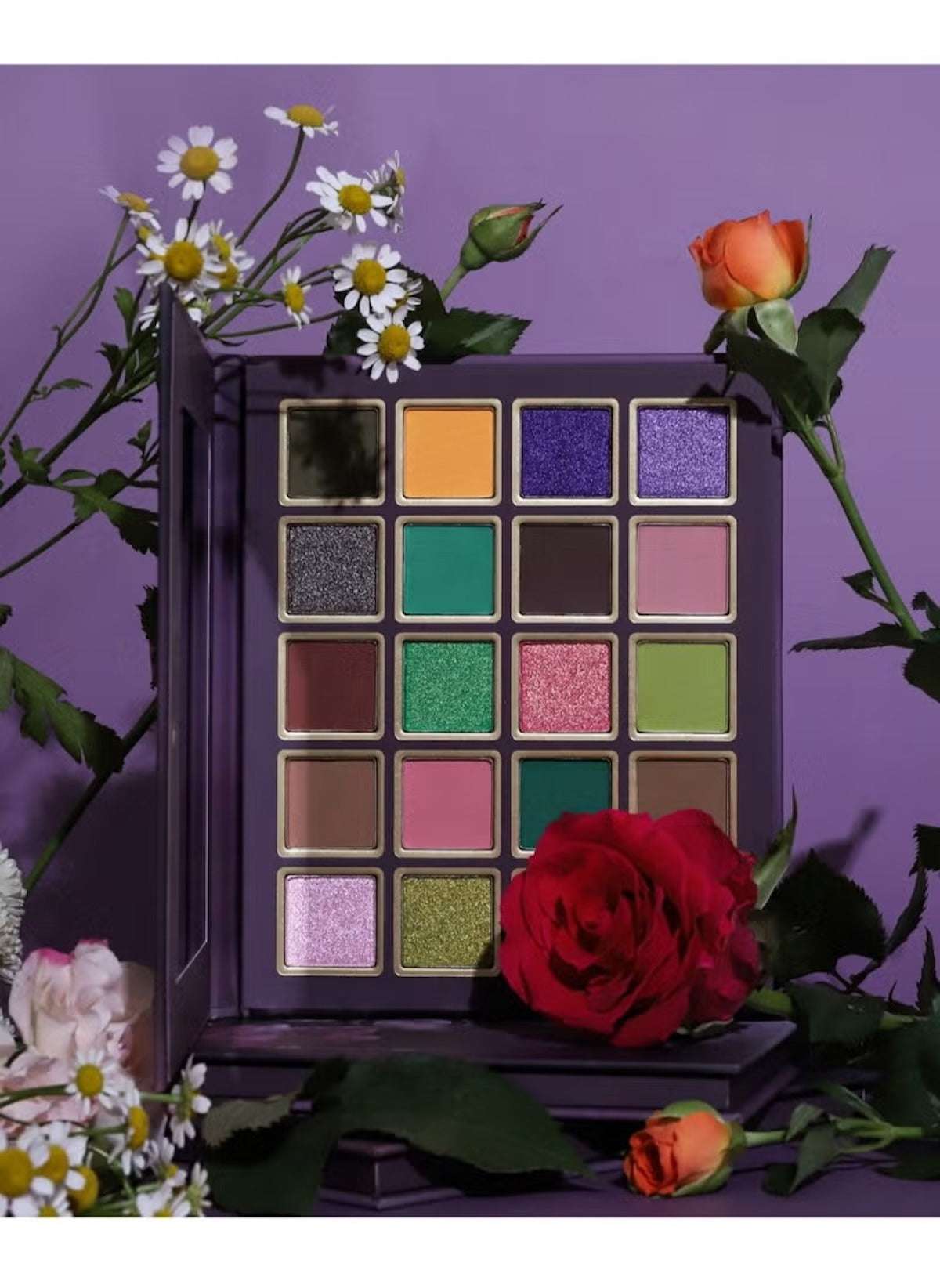 Huitich matte shimmer eyeshadow palette with vibrant purple, green, pink, and neutral shades surrounded by flowers