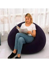 Purple inflatable lounge chair with wide armrests, shown in a living space