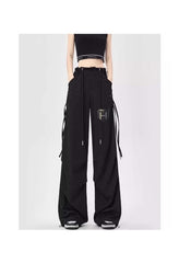 Black breathable flowy pants for women by Huitich with wide legs and adjustable side straps