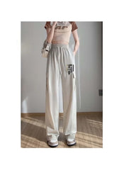 Huitich breathable flowy pants for women in light beige with cargo pockets and elastic waistband