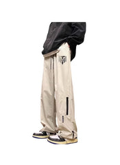 Huitich beige breathable outdoor pants for men with black zipper pocket and logo detail