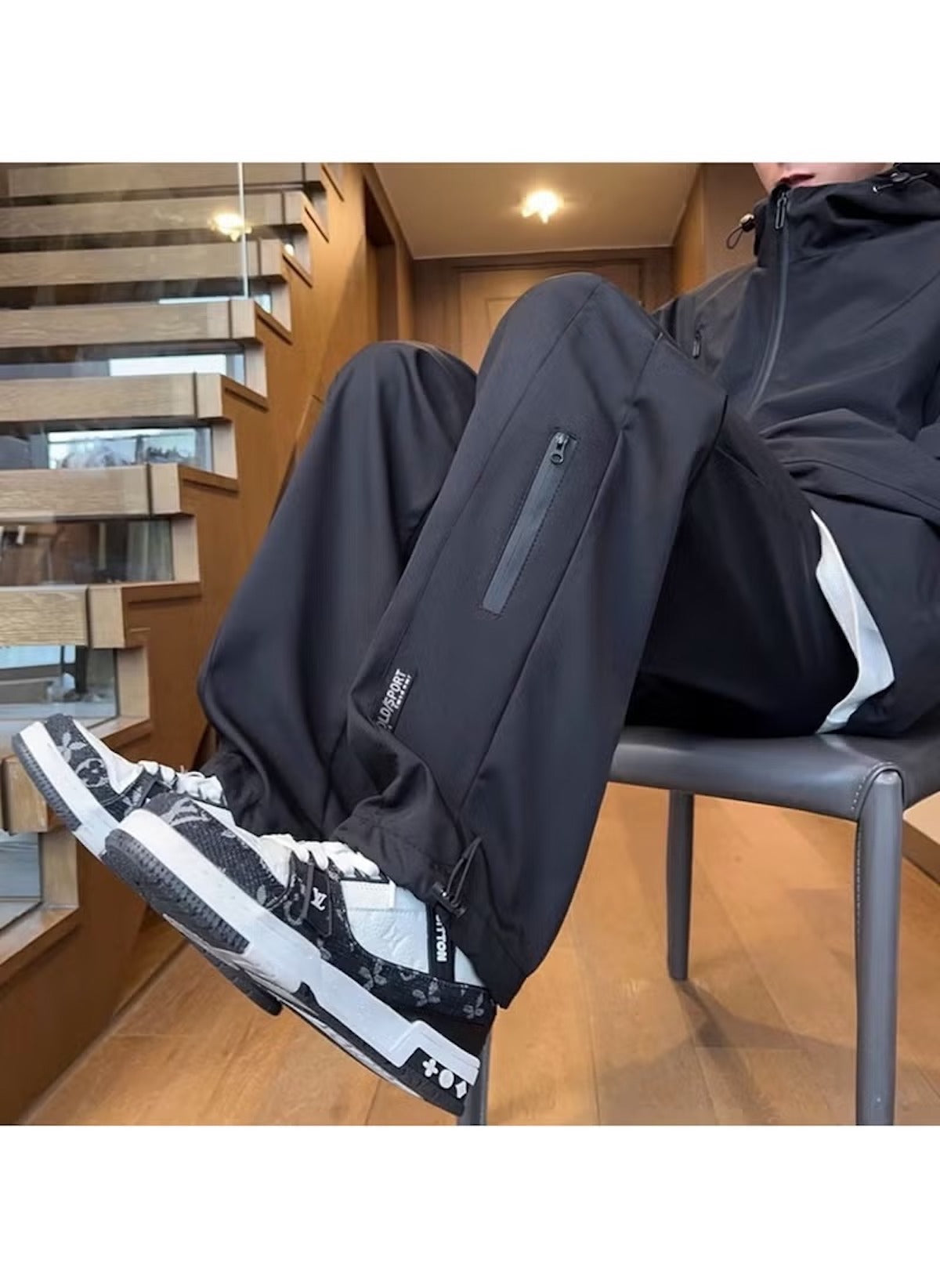 Huitich breathable outdoor pants for men in black with zippered pockets and elastic cuffs