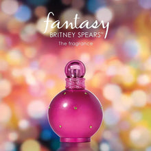 Pink perfume bottle with faceted cap, close-up