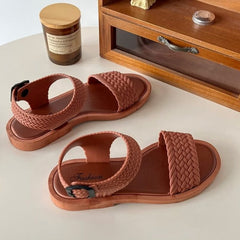 Huitich brown braided sandals for women with adjustable ankle straps on white surface
