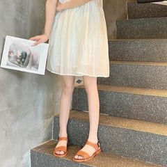 Huitich brown braided sandals for women worn with a white dress on stairs