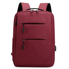 Red waterproof travel backpack with two front zipper pockets and padded straps