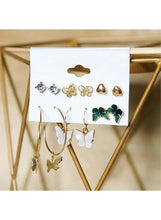 Assorted stud and hoop earrings display card with butterfly, bow, and heart designs