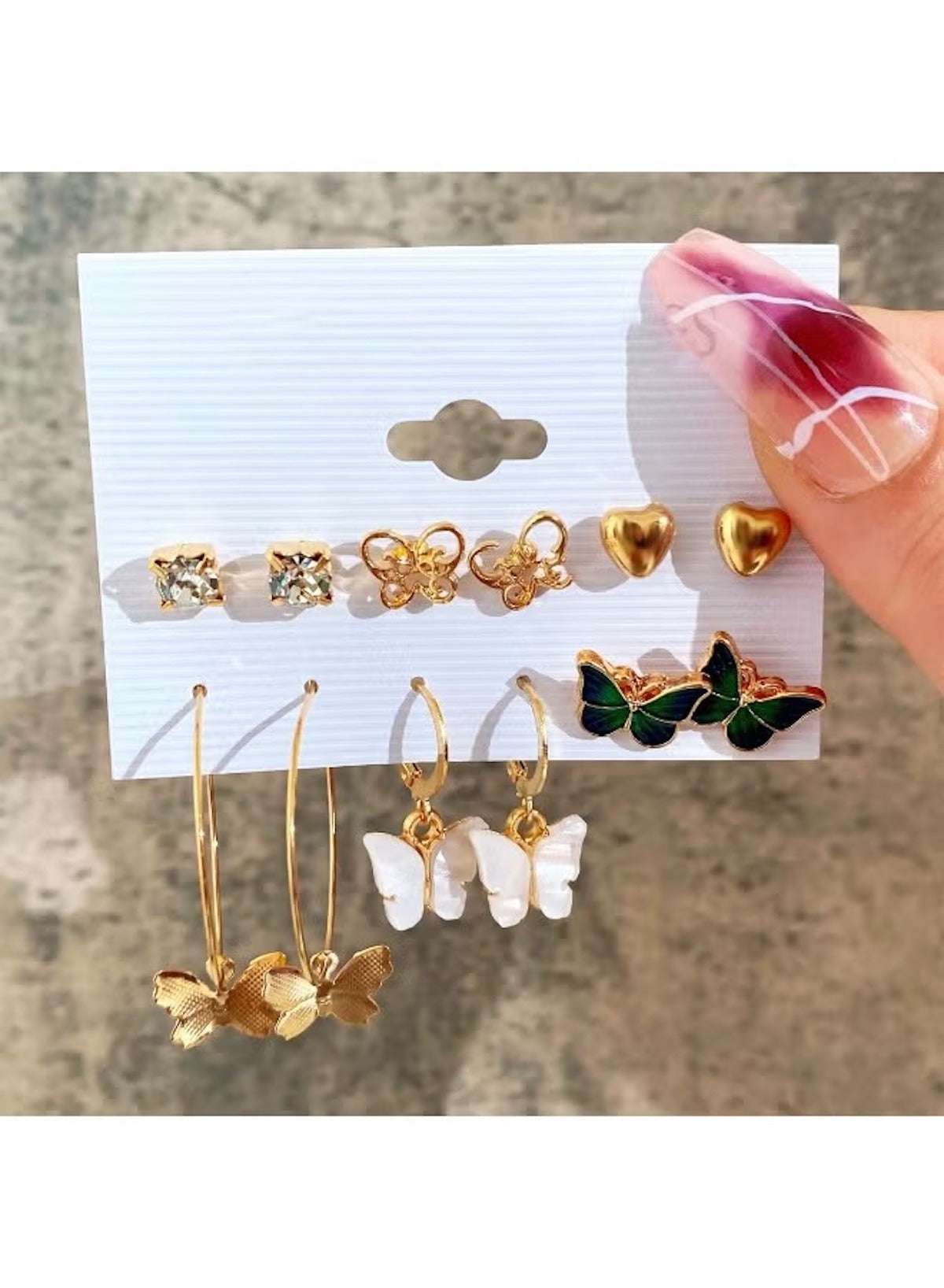 Butterfly and heart earring set for women featuring gold accents and pearl details