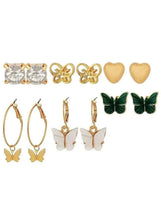 Earring set with heart studs, heart drops, hoop earrings, and green butterfly studs