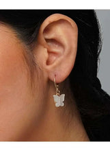 Gold butterfly drop earring on a hoop-style hook