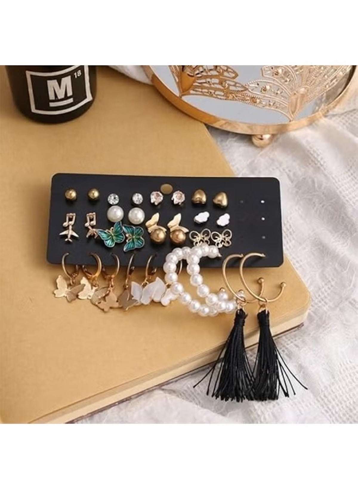 Huitich butterfly and pearl earring set featuring various styles and colors on a display card