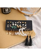 Earring set with pearl drops, gold butterfly studs, and black tassel dangle hoops