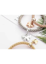 Butterfly charm bracelet set with braided bangles and silver and gold butterfly pendants