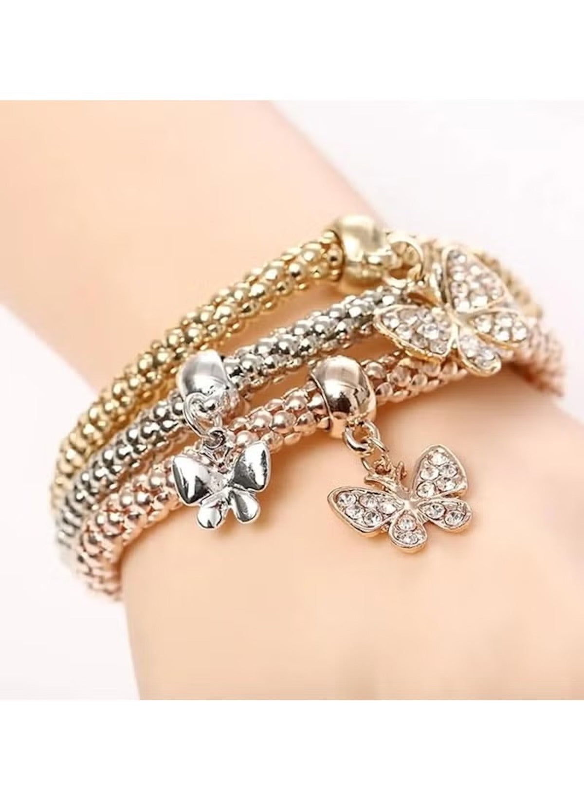 Huitich butterfly charm bracelet set with gold silver and rose gold tones featuring sparkling butterfly charms