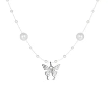 Minimal silver pearl necklace with round bead stations and a butterfly charm pendant.
