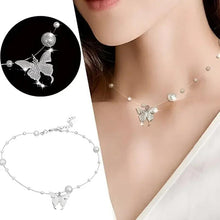 Butterfly pearl necklace with silver chain, small round beads, and butterfly charms.