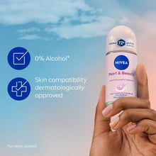 NIVEA Pearl & Beauty 72h anti-perspirant roll-on held in hand, pearl pink