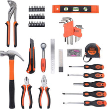 Assorted hand tools: orange-and-black screwdrivers, wrenches, pliers, level, tape measure