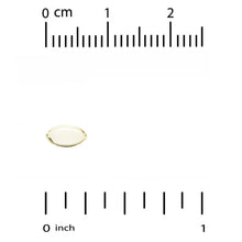 Single clear softgel capsule on size comparison scale