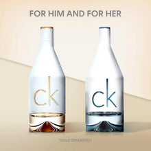 Two CK in2u Eau de Toilette bottles, one with gold accents, one with blue accents