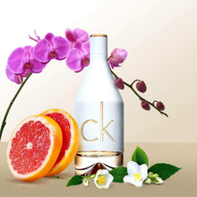 Eau de Toilette bottle with gold CK logo, styled with pink orchids and citrus