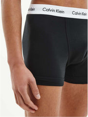 Black cotton boxer briefs 3 pack by Calvin Klein with white branded waistband on male model