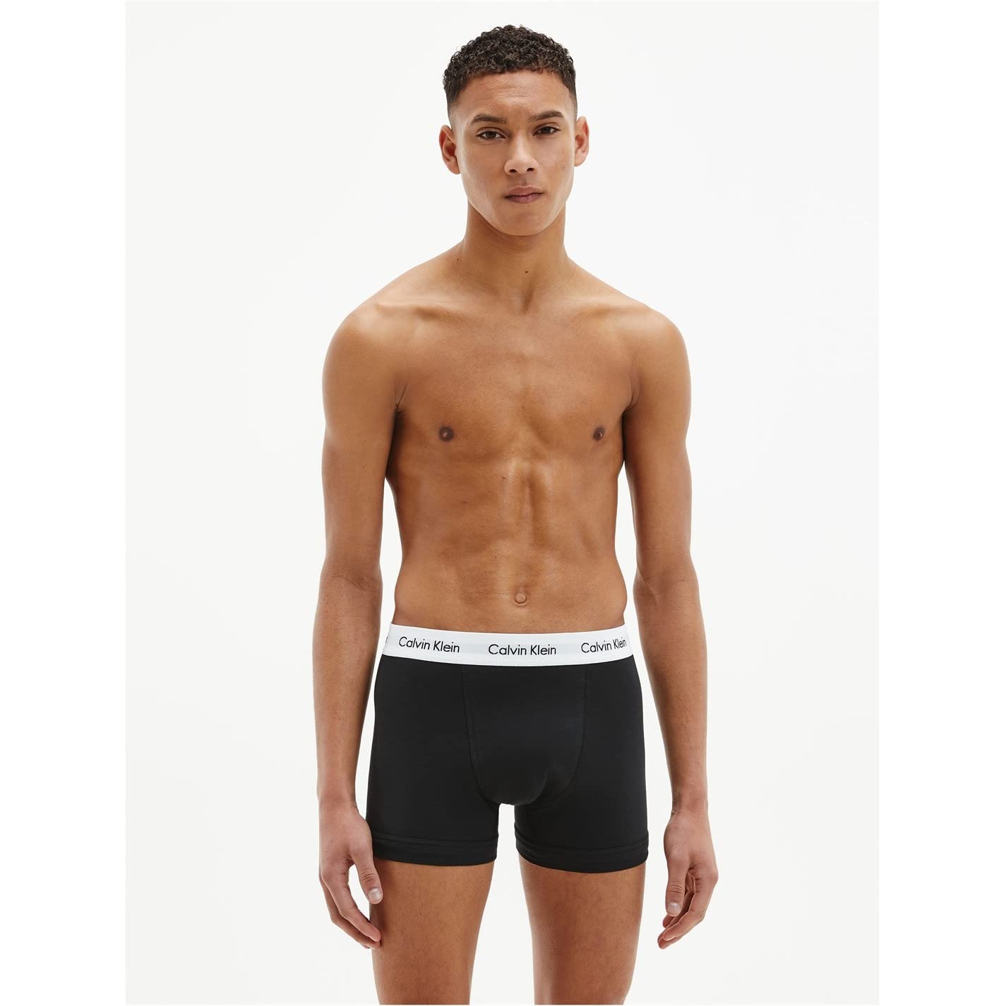 Male model wearing black cotton boxer briefs 3 pack with white Calvin Klein waistband