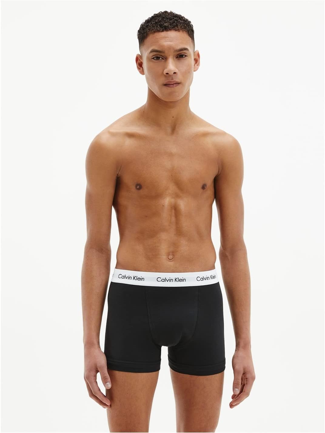 Man wearing black Calvin Klein cotton boxer briefs 3 pack with white waistband logo