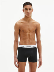 Man wearing black Calvin Klein cotton boxer briefs 3 pack with white waistband logo