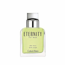 Eternity for Men after shave bottle, silver cap, light green liquid in clear glass
