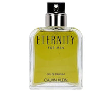 Calvin Klein Eternity for Men Eau de Parfum glass bottle with yellow liquid, chrome cap