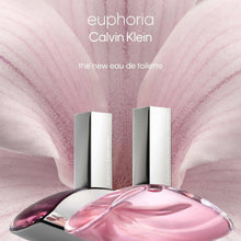 Perfume bottle with two cylindrical boxed bottles, pink glass and white caps