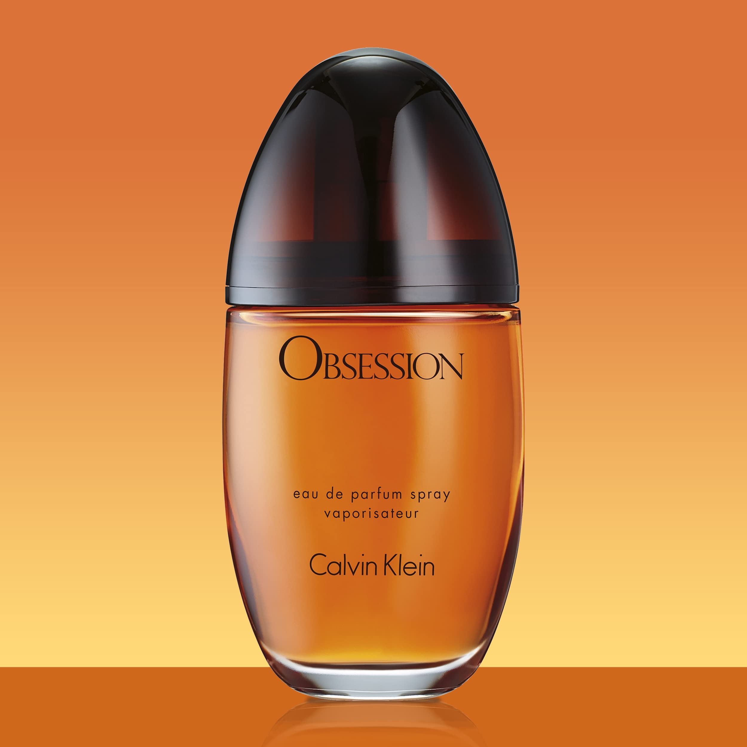 Calvin Klein Obsession perfume for women in a sleek bottle with an amber hue for a captivating scent experience