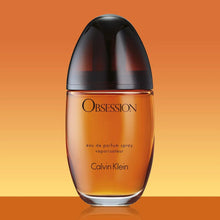 Calvin Klein Obsession Eau de Parfum bottle, amber liquid with dark rounded cap