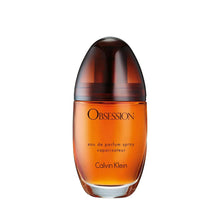 Calvin Klein Obsession Eau de Parfum bottle, amber liquid with dark rounded cap