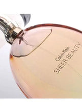 Calvin Klein Sheer Beauty EDT glass perfume bottle close-up with spray nozzle