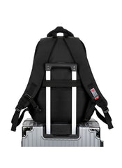 Black huitich camouflage school backpack for boys attached to silver luggage handle with adjustable straps