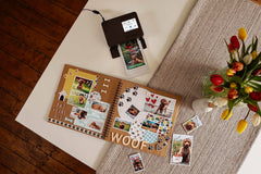Canon RP108 ink and paper set printing pet photos for a scrapbook on a white and beige table