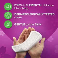 Unscented white panty liner with embossed texture, held in hands