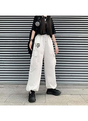 White cargo style wide leg pants for ladies styled with black t-shirt and sneakers