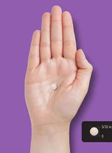 Melatonin 12 mg fast-dissolve tablet on open palm beside bottle