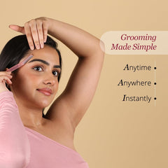 Young woman using a pink reusable face razor for women to trim eyebrow and facial peach fuzz while grooming
