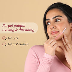 Carmesi reusable face razor for women shown being used on cheek by smiling woman, claims no cuts no rashes