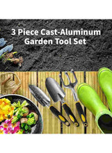 Three cast-aluminum garden tools with gray heads and green handle accents