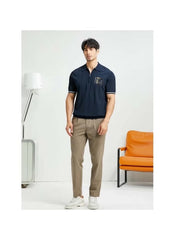Huitich casual half zipper polo shirt in navy blue worn by man with tan pants and white sneakers