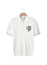 Men’s white knit polo shirt with short sleeves, half zipper, and chest logo patch