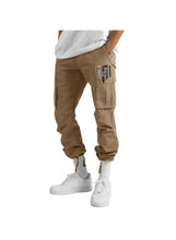 Beige men’s cargo pants with straight legs, side and thigh cargo pockets, ankle cuffs
